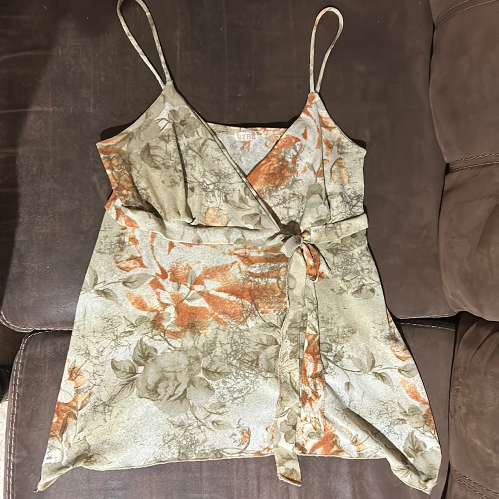 This is a bzbz spaghetti strapped tan with leaves top, size women’s large.